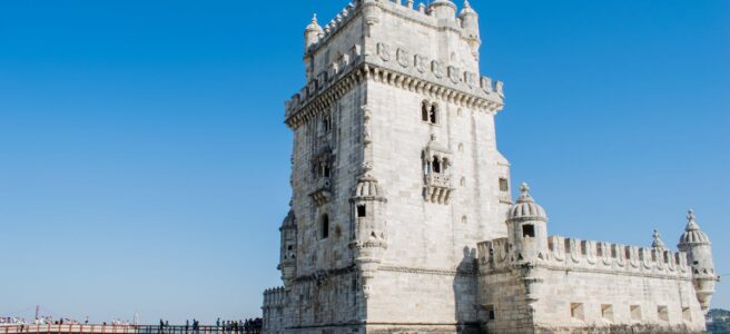 Capture of the historic Belem Tower against a clear blue sky in Lisbon, Portugal.